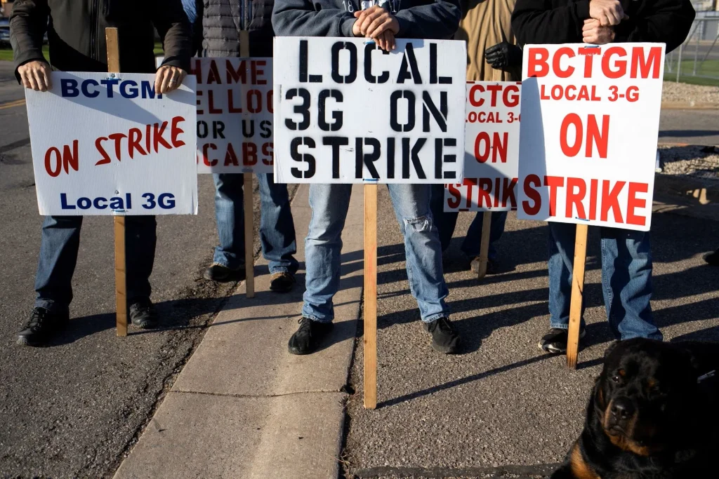 People on strike holding placards