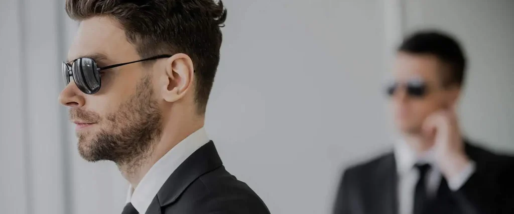 Two executive bodyguards in sunglasses