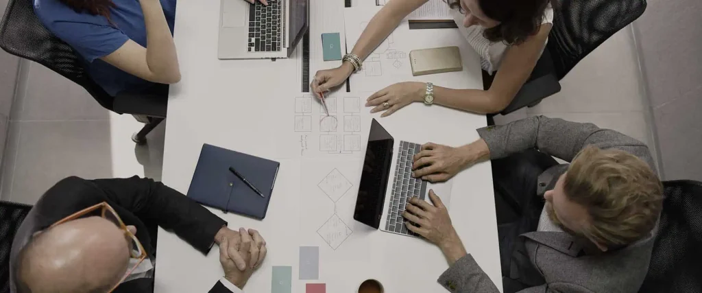 Executive team members working together at a conference table
