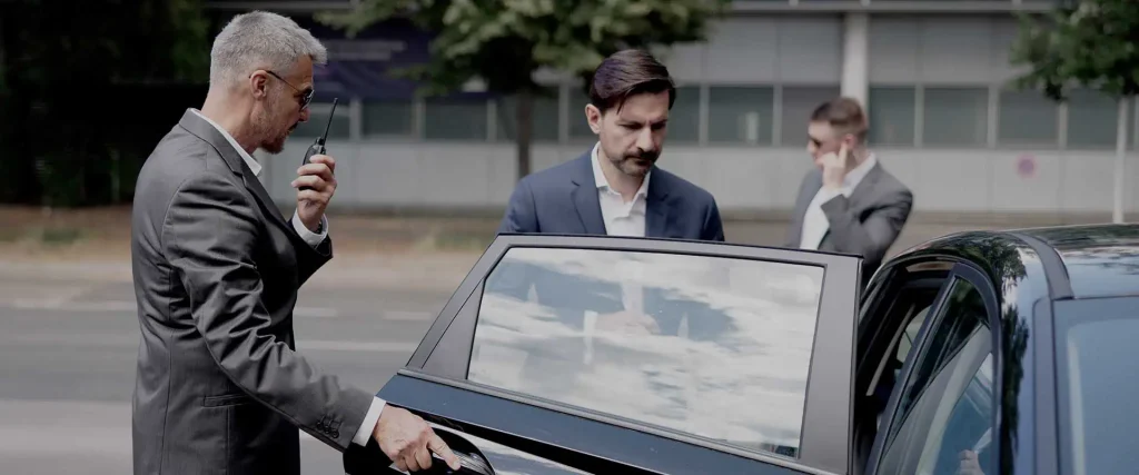 CEO entering a car with executive protection